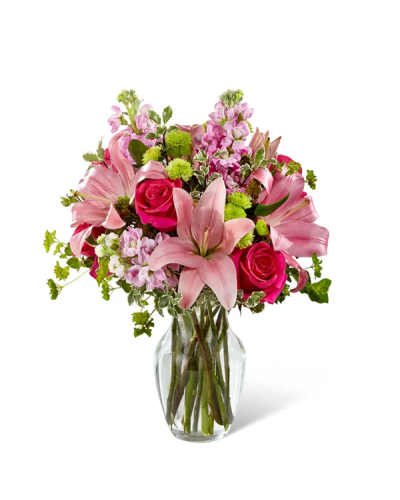 The Pink & Posh Bouquet is a chic celebration of all things bright and beautiful—a pink wonderland designed to honor life’s most cherished moments. Vibrant hot pink roses bloom alongside soft pink Asiatic lilies, delicate stock, green button poms, bupleurum, and rich greenery for a fresh and stylish floral statement.

Arranged in a classic clear glass vase, this blushing bouquet is the perfect way to share joy, gratitude, or heartfelt wishes for a birthday, anniversary, or any special occasion.